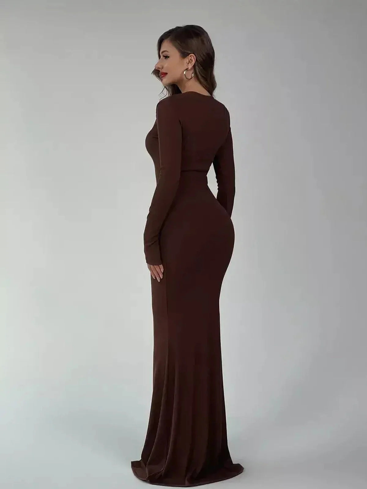 Elegant brown Sculpted Aura Maxi Dress highlighting a fitted silhouette and long sleeves, perfect for any occasion.