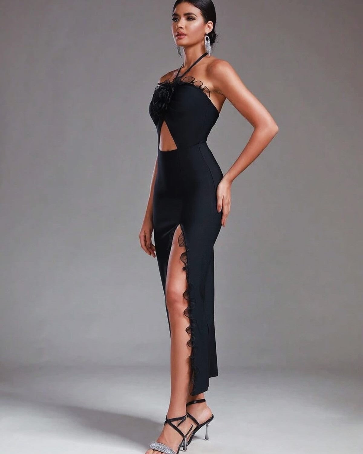 Elegant black midi dress with lace detailing and thigh-high slit, perfect for cocktail and evening events.