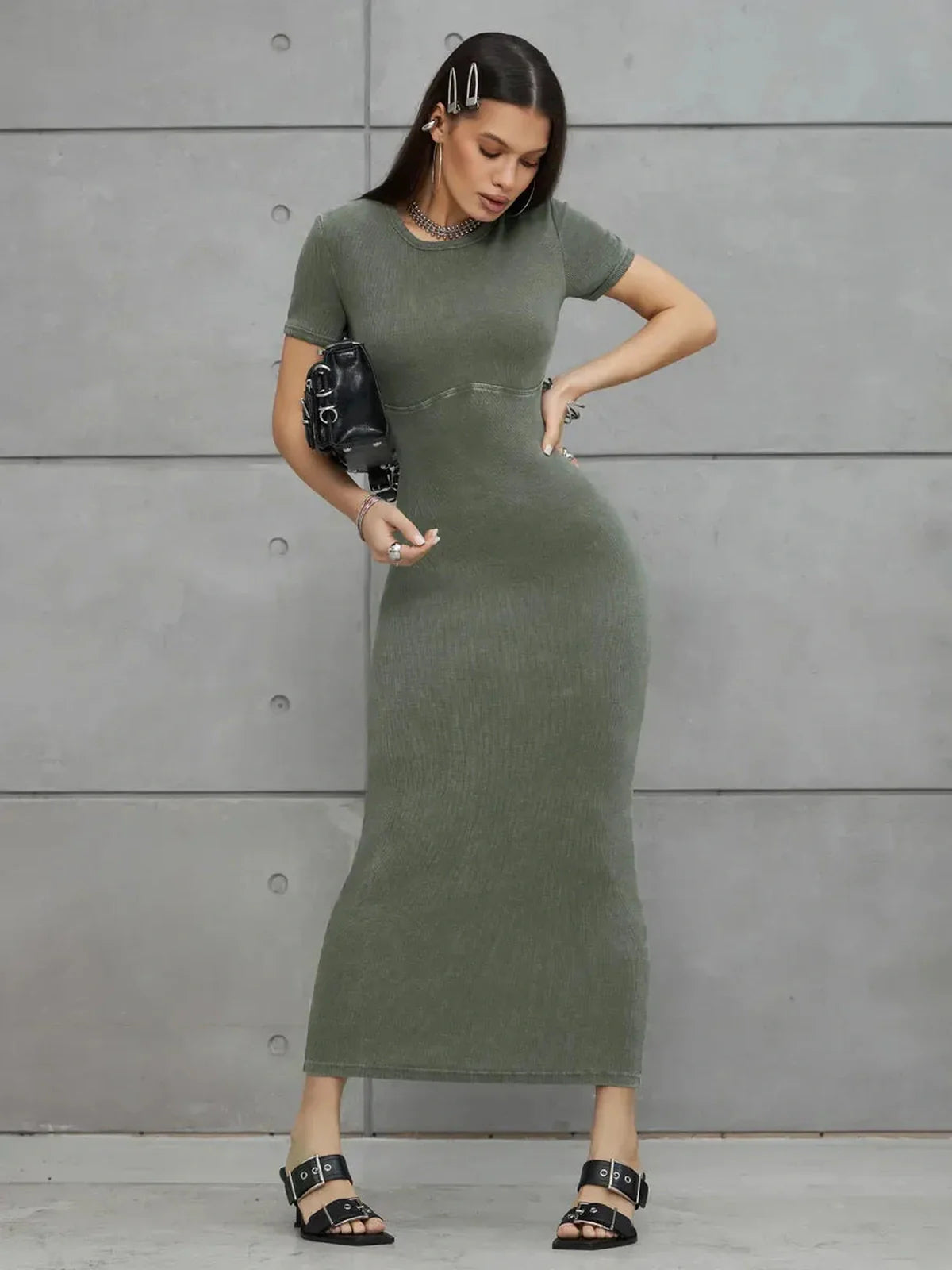 Olive Line Maxi Dress in khaki green ribbed cotton, featuring a fitted ankle-length silhouette and stylish accessories.