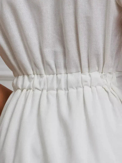 Close-up of the cinched waist detail of the Maxi Dress Pearl Whisper, showcasing the elegant gathered design.