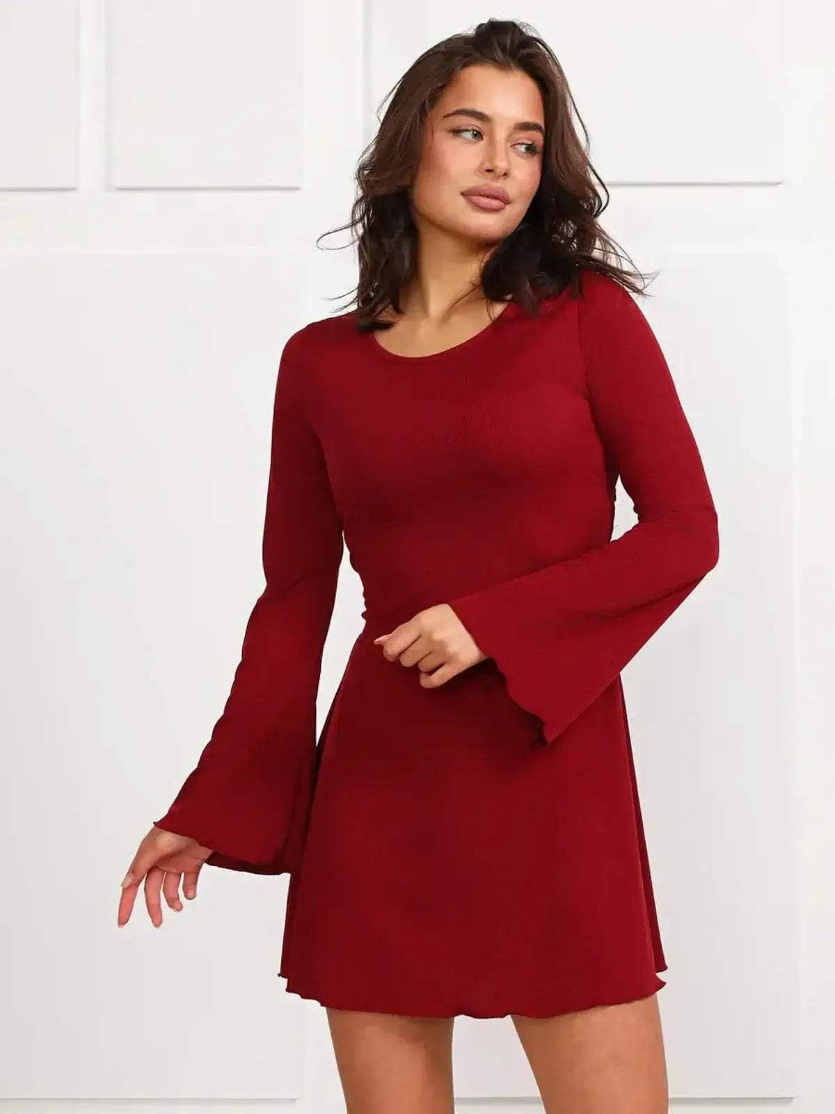 Ruby Laced red mini dress with long bell sleeves, perfect for parties, graduation, and weddings.