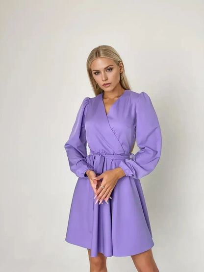 Elegant lavender mini dress with V-neckline and cinched waist, perfect for trendy feminine looks.