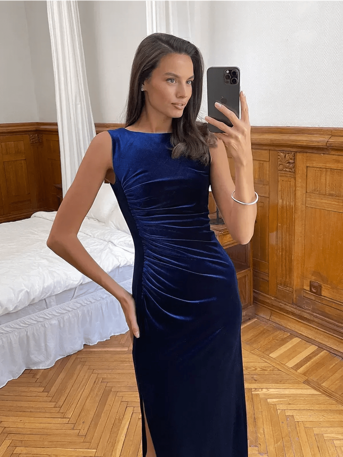Model showcasing the Velvet Grace Maxi Dress in midnight blue, featuring a sculpted silhouette and plush stretch velvet.