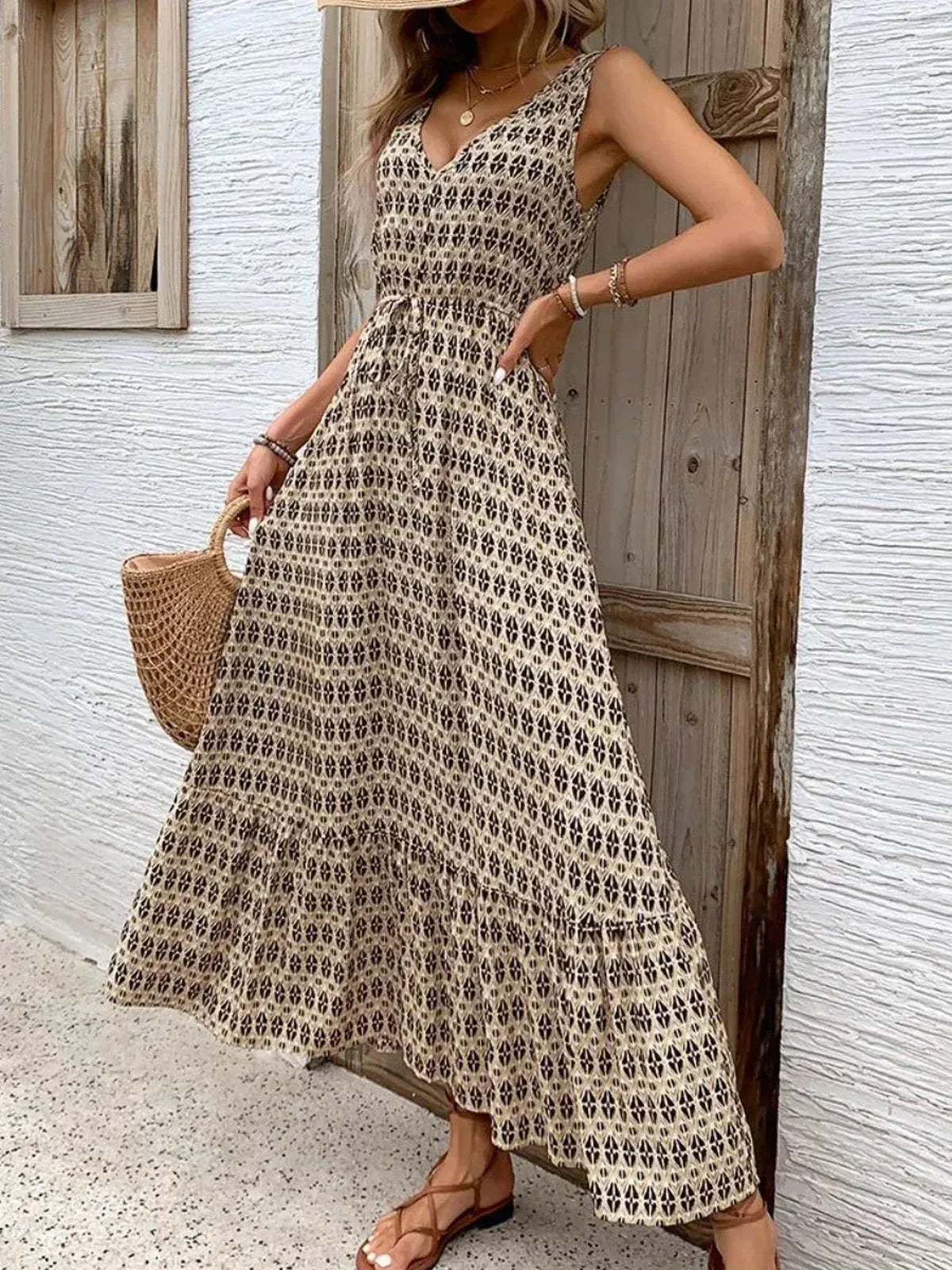 Solana Maxi Dress in boho print, showcasing a sleeveless design and tiered skirt, perfect for summer outings.