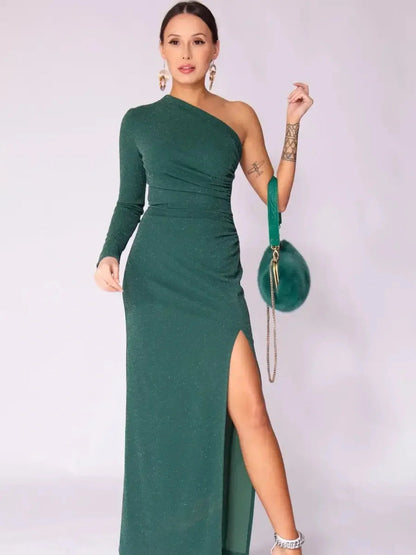 Emerald Spark Maxi Dress in rich green with shimmer, featuring a one-shoulder design and high side slit for elegance.