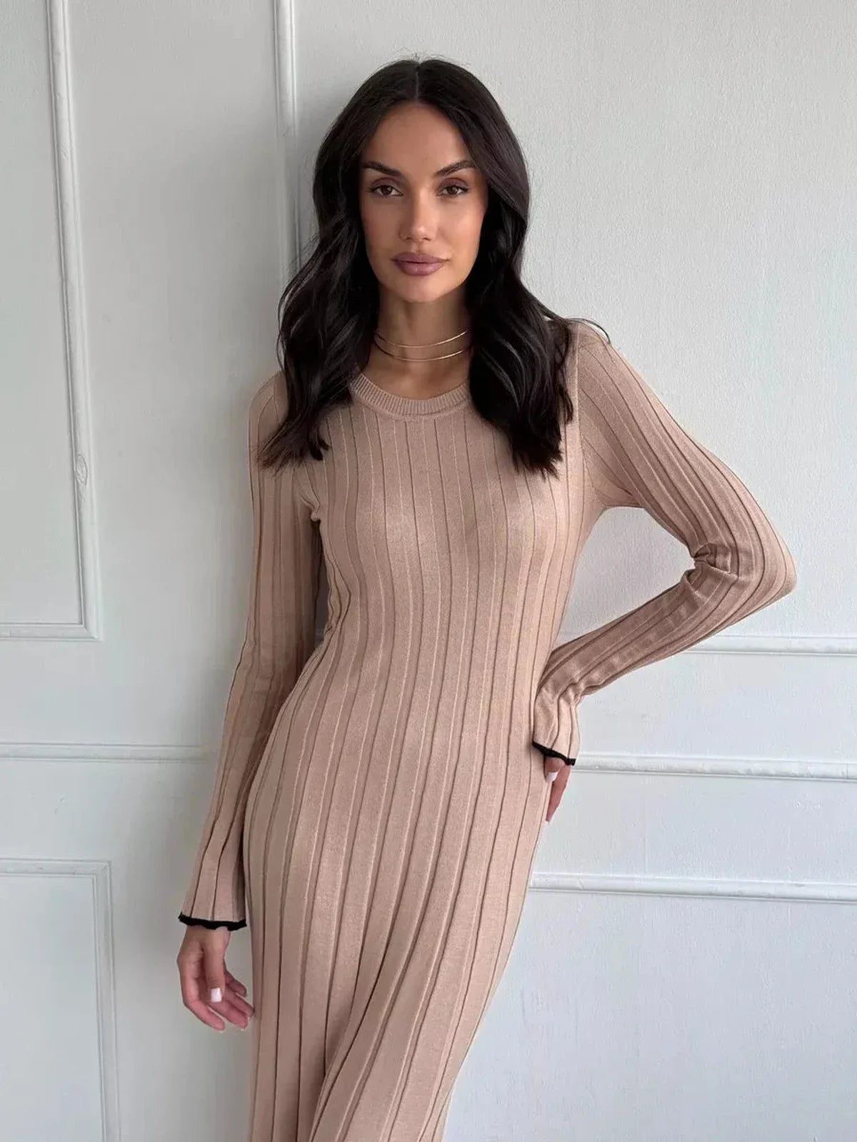 Sahara Curve Maxi Dress in sandstone beige, featuring a ribbed texture and a sculpted fit, perfect for minimalist styling.