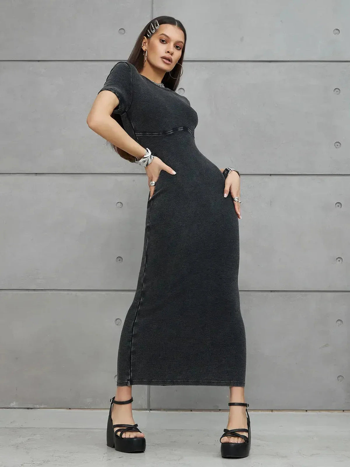 Graphite Form Maxi Dress showcasing a sculpted fit and edgy silhouette against a minimalist backdrop.