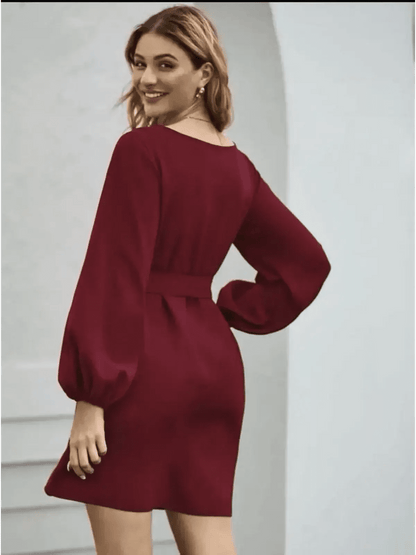 Elegant burgundy mini dress with voluminous long sleeves and a cinched waist, perfect for wedding guests or formal occasions.