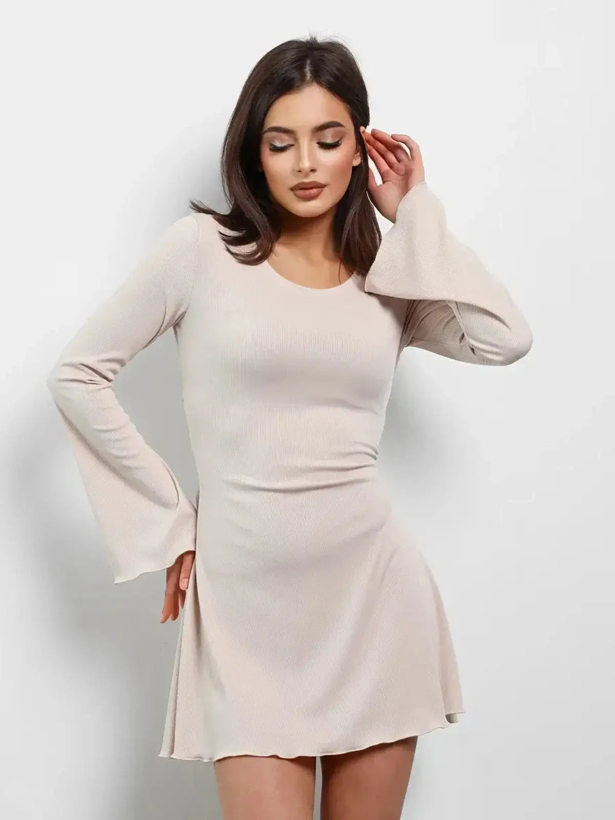 Cream Laced long sleeve mini dress in soft beige with flared sleeves and a flattering fit, perfect for summer and weddings.
