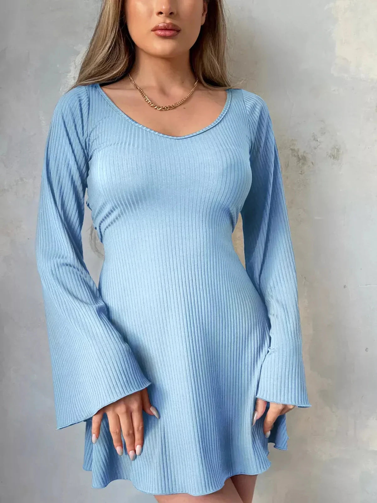 Sky Flare mini dress in light blue with fluted sleeves, perfect for summer events and casual outings.