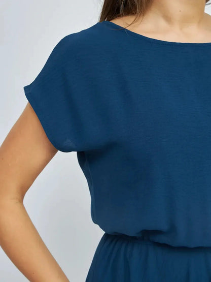 Close-up of the Verona Maxi Dress showcasing its lightweight navy fabric and elegant short sleeves.