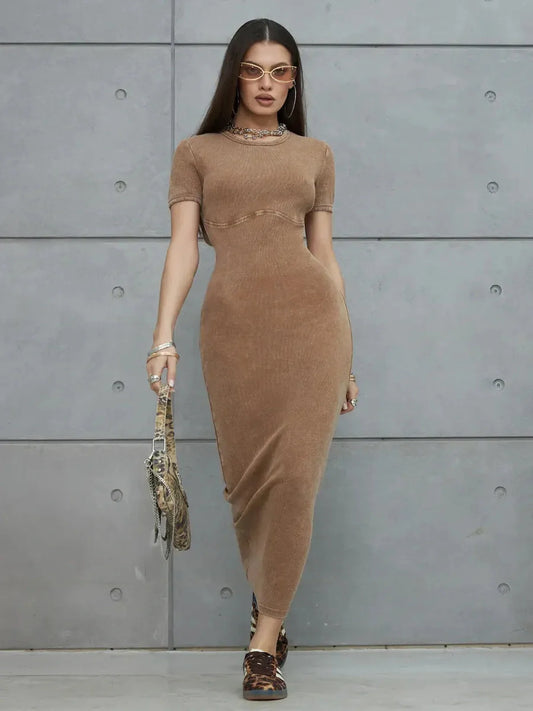 Model wearing Sculpted Ease Maxi Dress in washed tobacco color, showcasing a sculpted silhouette and minimalist design.