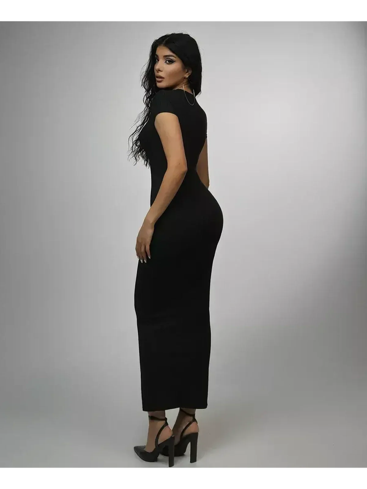 Obsidian Maxi Dress showcasing a sculpted silhouette in luxe rib knit, emphasizing modern elegance and comfort.