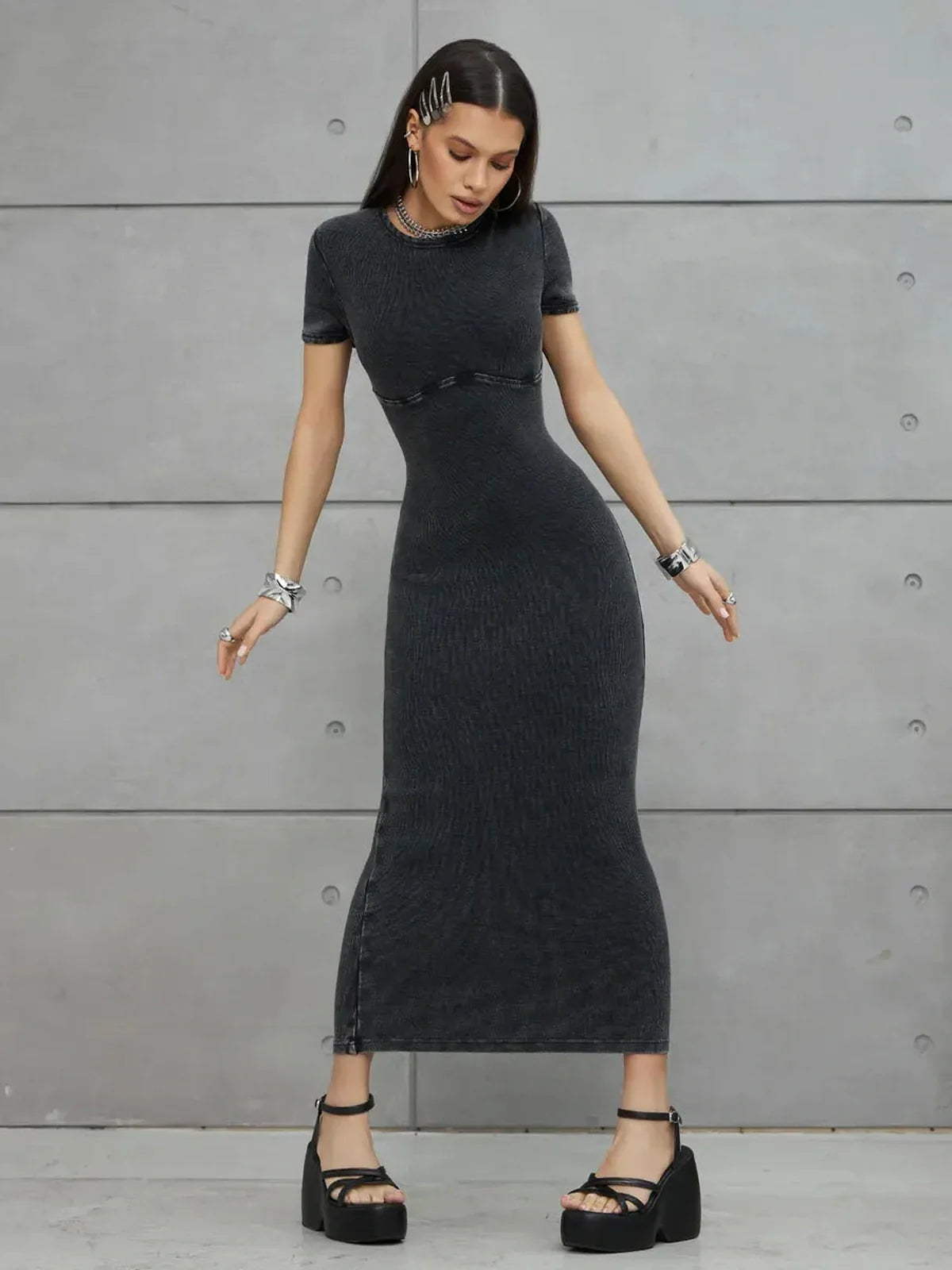 Graphite Form Maxi Dress featuring a sculpted fit and urban edge, styled with bold platform heels.
