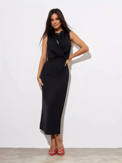Model wearing the Noir Drape Maxi Dress, showcasing its elegant silhouette and chic style for formal events.