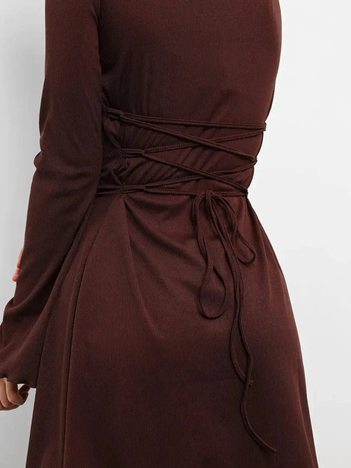 Back detail of Cocoa Laced mini dress featuring adjustable lace-up design and soft ribbed texture.