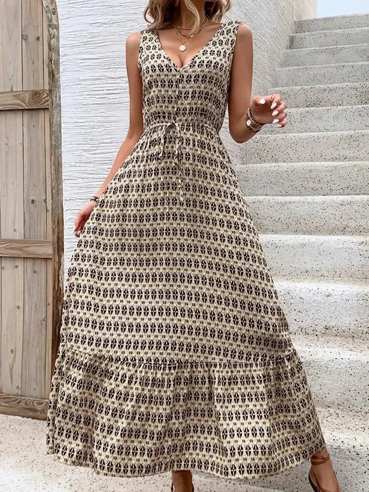 Solana Maxi Dress featuring a boho pattern, sleeveless design, soft V-neckline, and tiered skirt perfect for summer gatherings.
