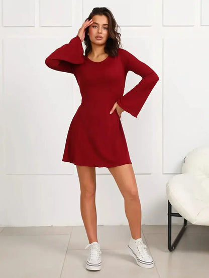Ruby Laced mini dress in rich red with long bell sleeves, perfect for parties and special occasions.
