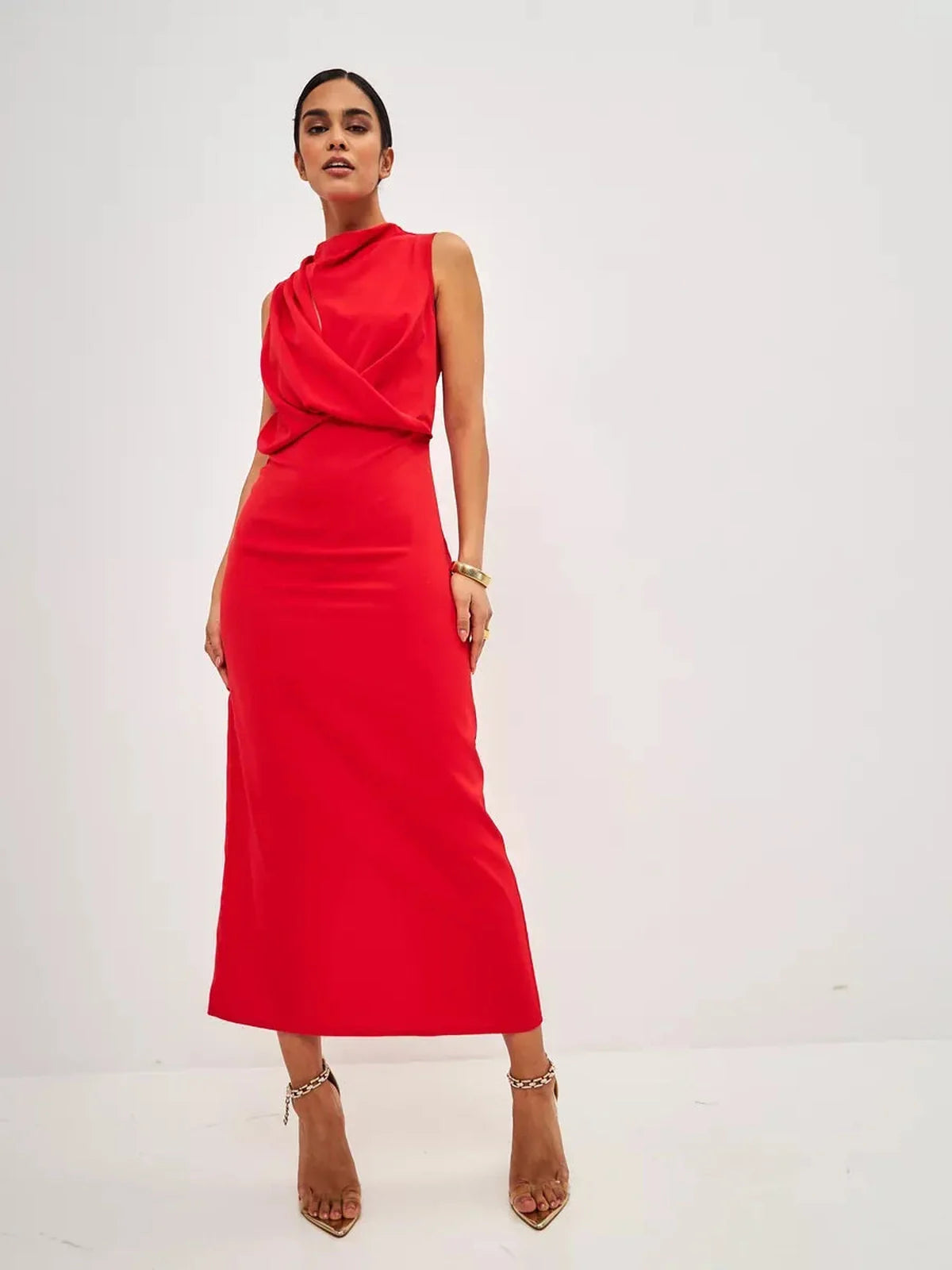 Model wearing a stunning Red Drape Maxi Dress showcasing an elegant, figure-skimming silhouette and artful neckline.