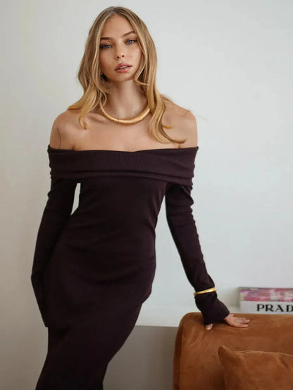 Model in off-shoulder Elegance Maxi Dress showcasing chic ribbed texture and elegant style.