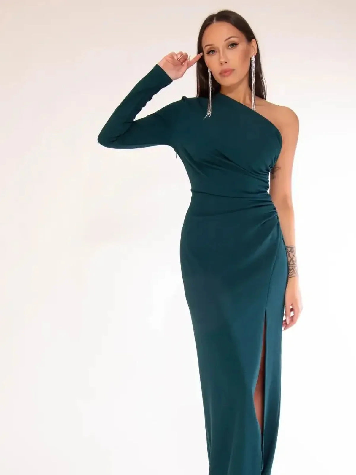One-shoulder emerald green maxi dress with high leg slit, perfect for formal occasions.