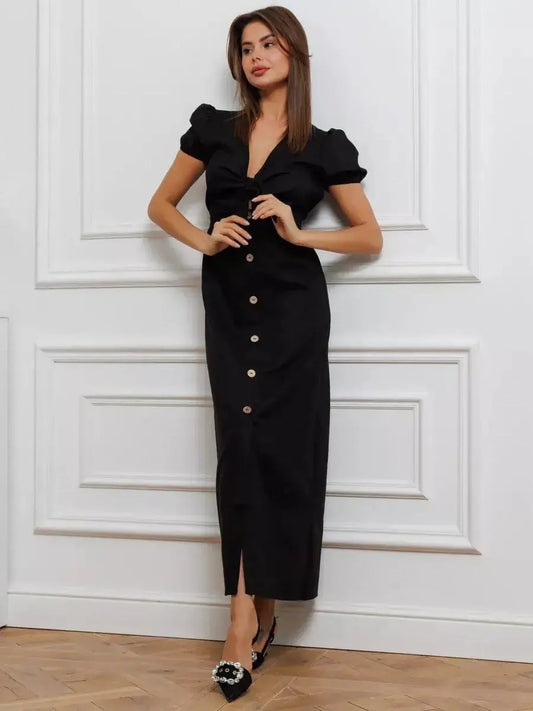 Elegant black maxi dress with tie-front detail, puff sleeves, and button accents, perfect for stylish occasions.