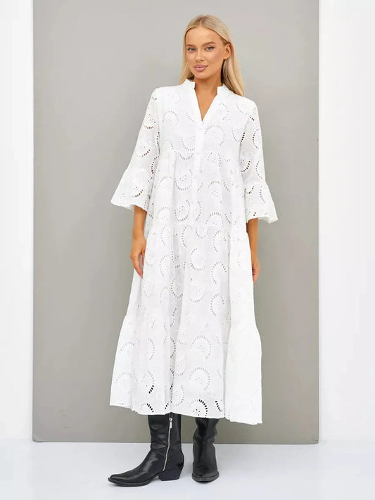 Broderie cotton maxi dress with flared sleeves and V-neck, showcasing breezy elegance for sunny days.