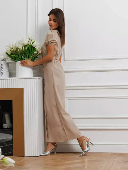 Elegant model wearing Serene Bond Maxi Dress with puff sleeves and waist tie, showcasing timeless style in neutral hues.