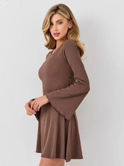Model showcasing the Flare Hour Mini dress in soft ribbed knit with bell sleeves and flared hem, perfect for elegant occasions.