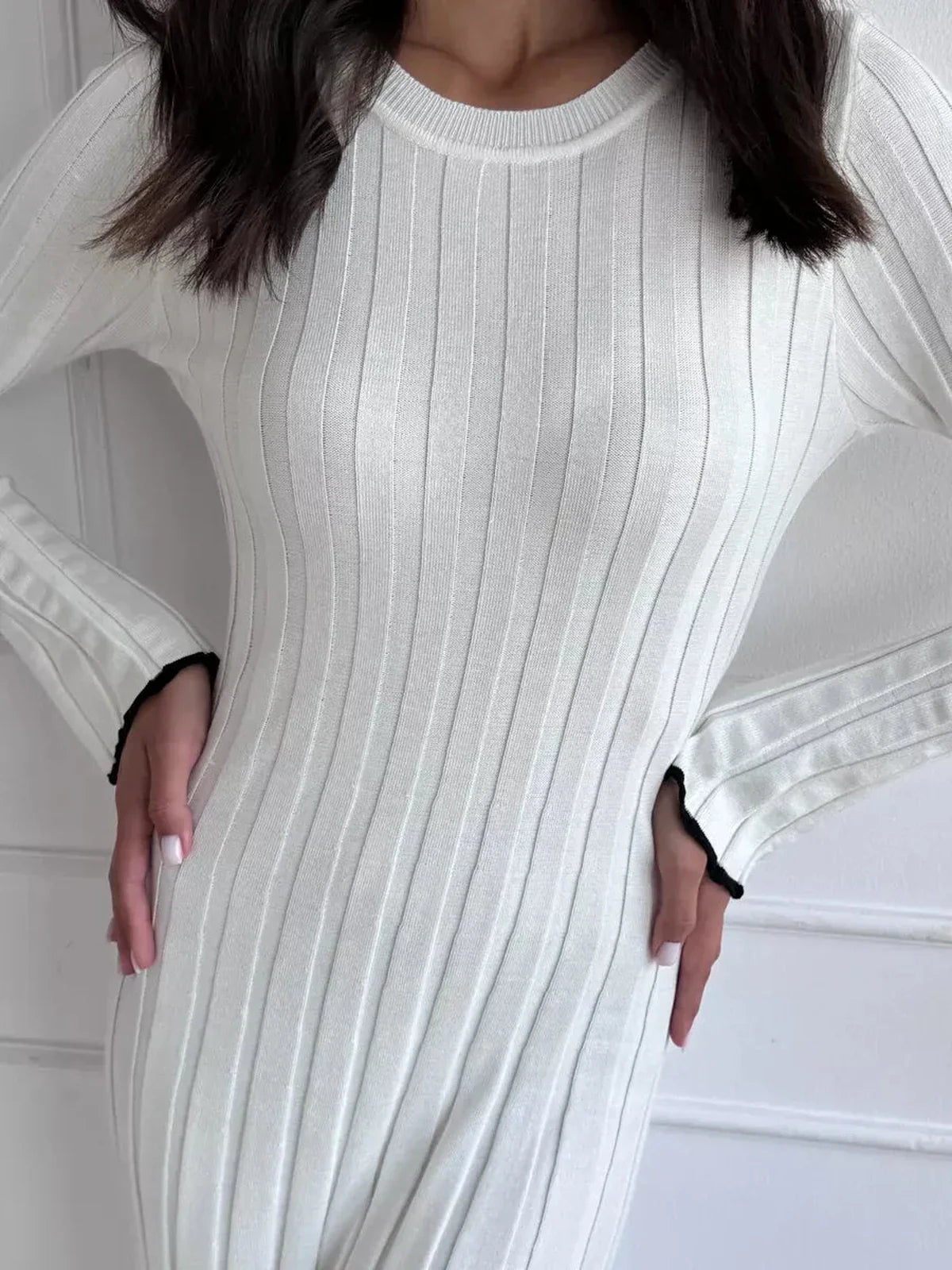 Ivory Grace Maxi Dress featuring elegant ribbed texture and long sleeves for a chic, sculpted silhouette.