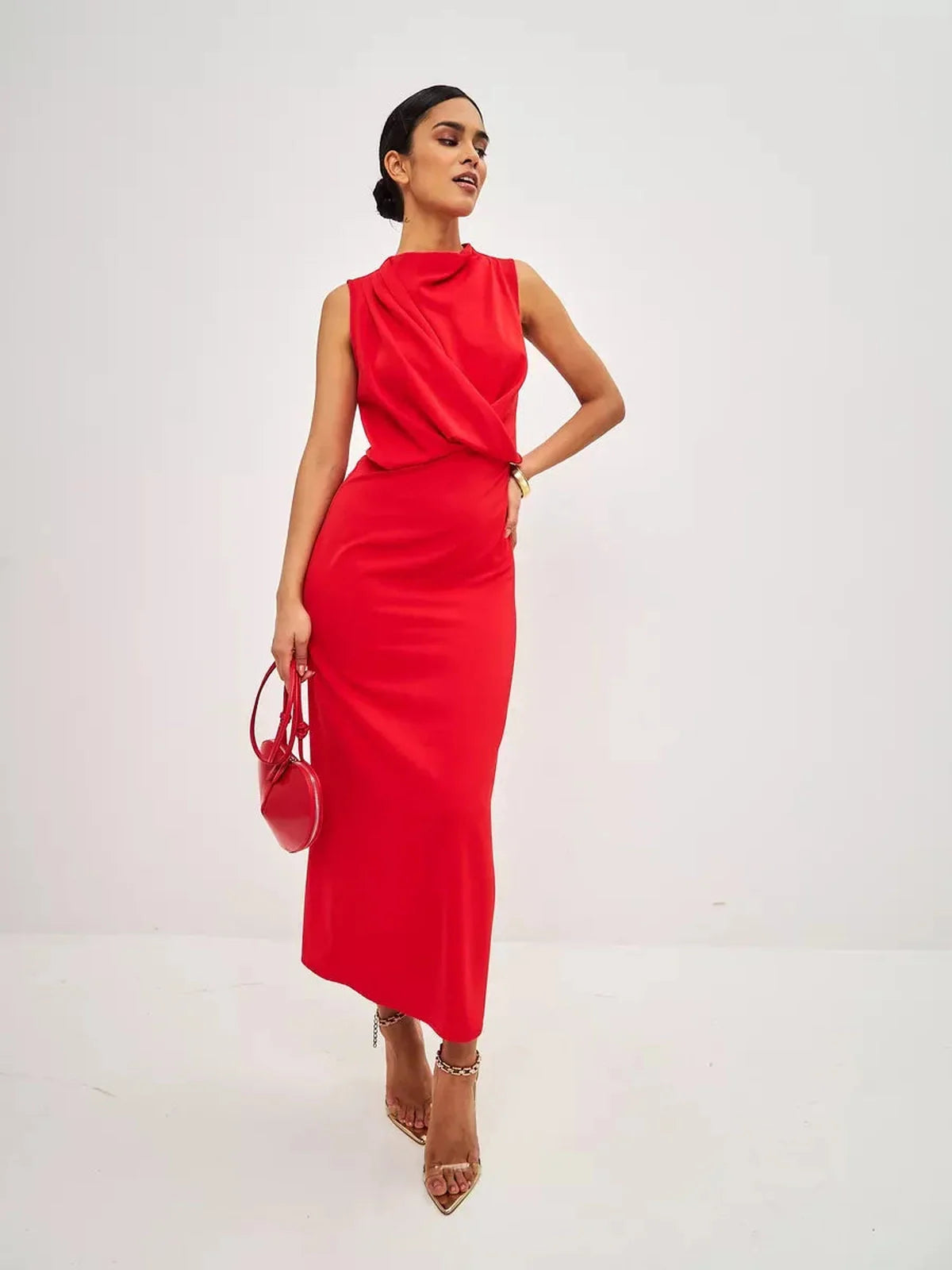 Model showcasing a Red Drape Maxi Dress with a sleek silhouette, perfect for formal occasions and cocktail parties.