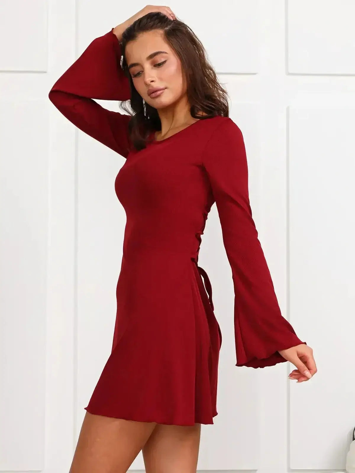 Ruby Laced red mini dress with bell sleeves and lace-up back detail, perfect for summer parties and graduation.