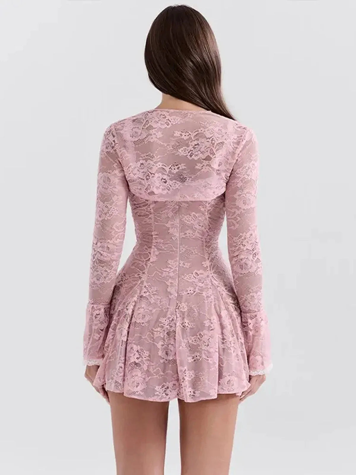 Back view of a pink lace Adele Mini Dress featuring long sleeves and a flared skirt, perfect for summer events.