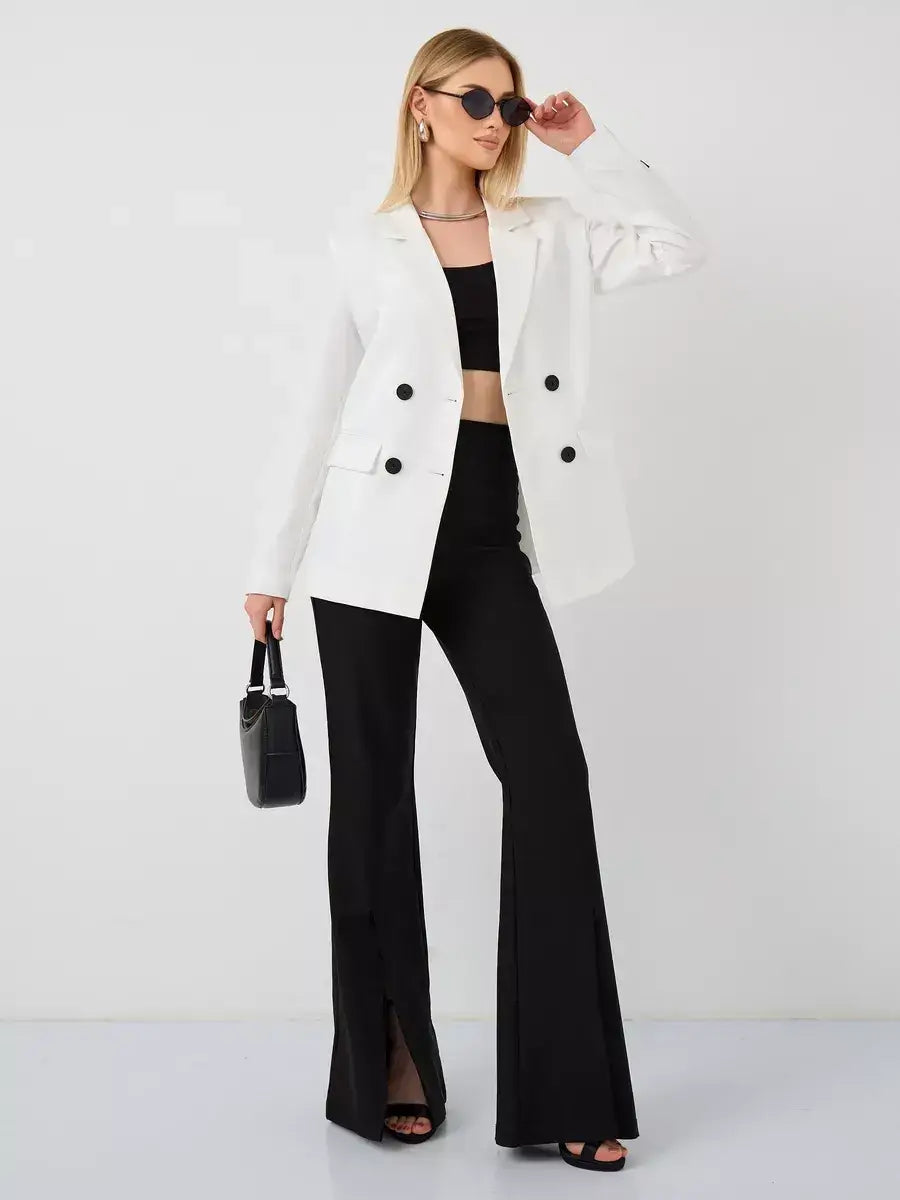 Alabaster Blazer by Lauven, an oversized double-breasted white tailored jacket styled with black flared pants.