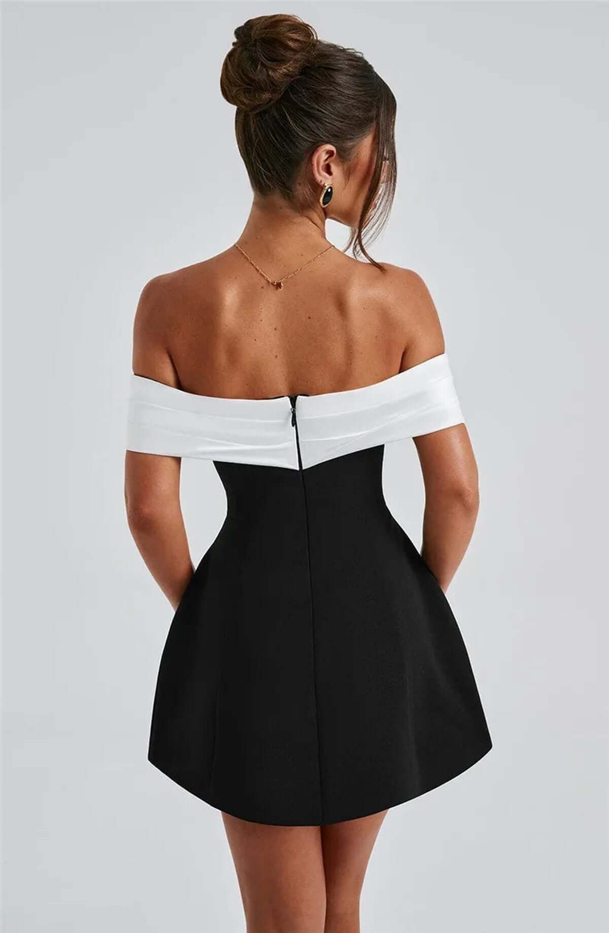 Back view of the Alba Mini Dress featuring an off-shoulder satin neckline and oversized white bow, perfect for summer events.
