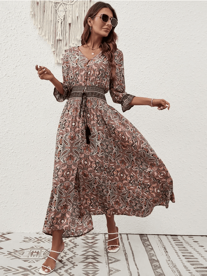 Amber Muse Maxi Dress featuring a paisley pattern and smocked waistband, perfect for summer boho elegance.