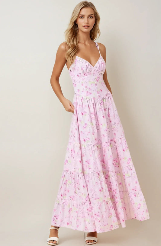 Amélie Dress: a soft pink floral maxi dress with spaghetti straps and a tiered skirt, perfect for summer and weddings.