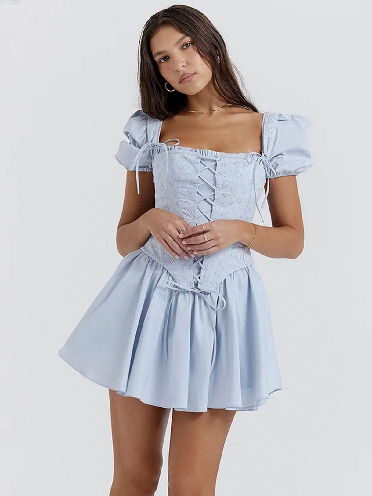 Light blue Anya Mini Dress featuring a detachable corset and puff sleeves, perfect for summer occasions.
