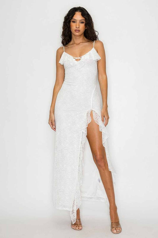 Elegant Aurora Maxi Dress in soft ivory lace, featuring ruffles and a thigh-high slit, perfect for weddings and summer events.