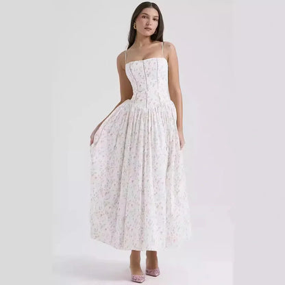 Ethereal floral maxi dress with spaghetti straps, perfect for summer weddings or formal occasions.