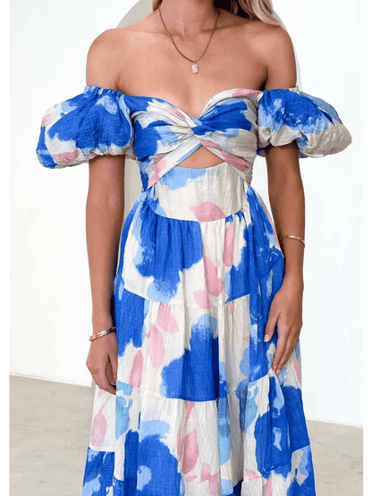 Azure Bloom Maxi Dress featuring off-shoulder neckline and watercolor floral prints in blue and pink.