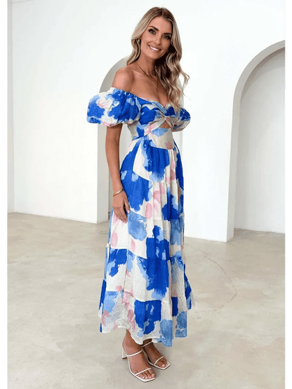 Azure Bloom Maxi Dress featuring watercolor floral prints and an off-shoulder neckline, perfect for summer occasions.