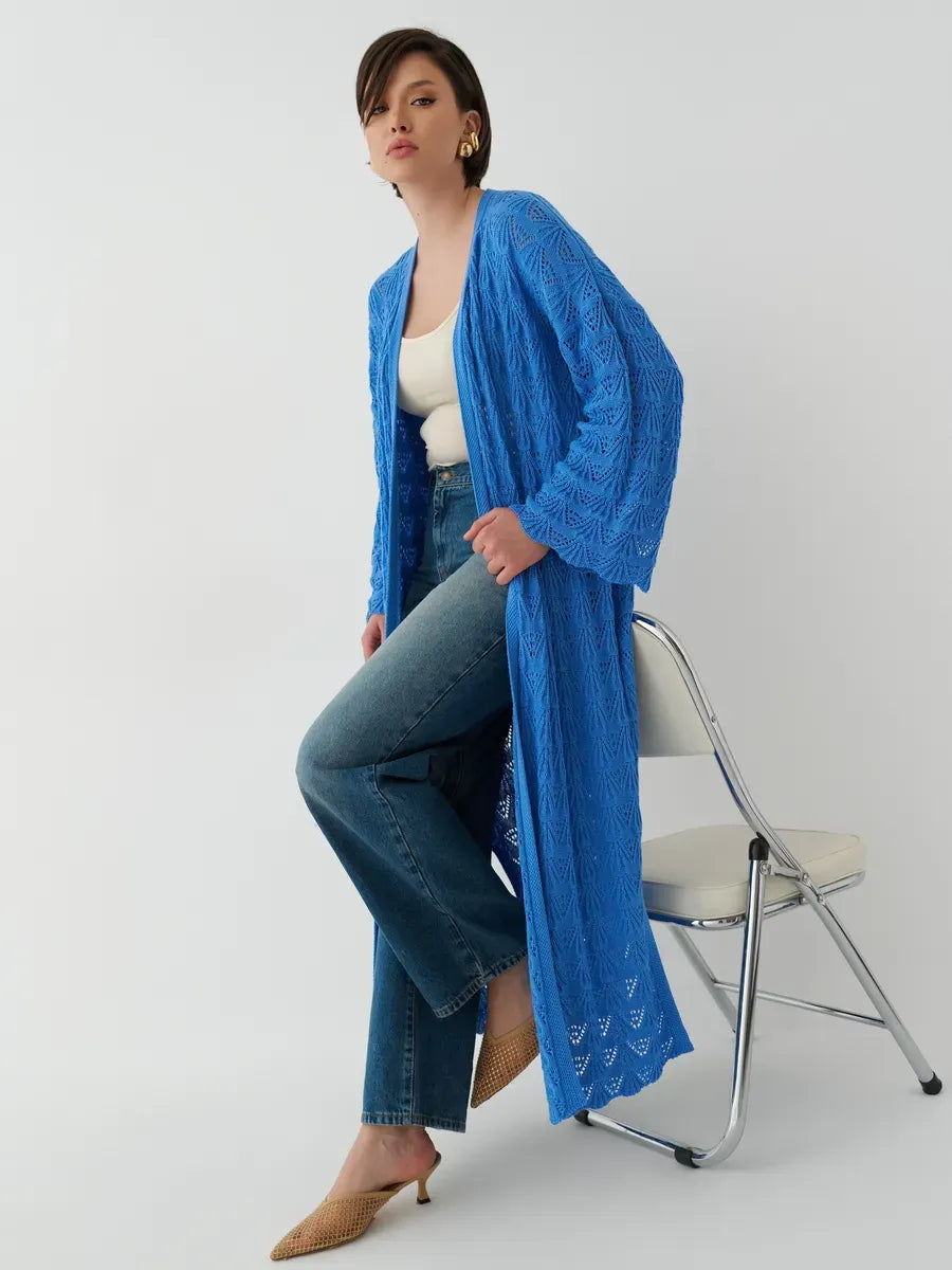Model wearing Lauven Azure Cardigan, a lightweight openwork summer cardigan in vibrant blue.