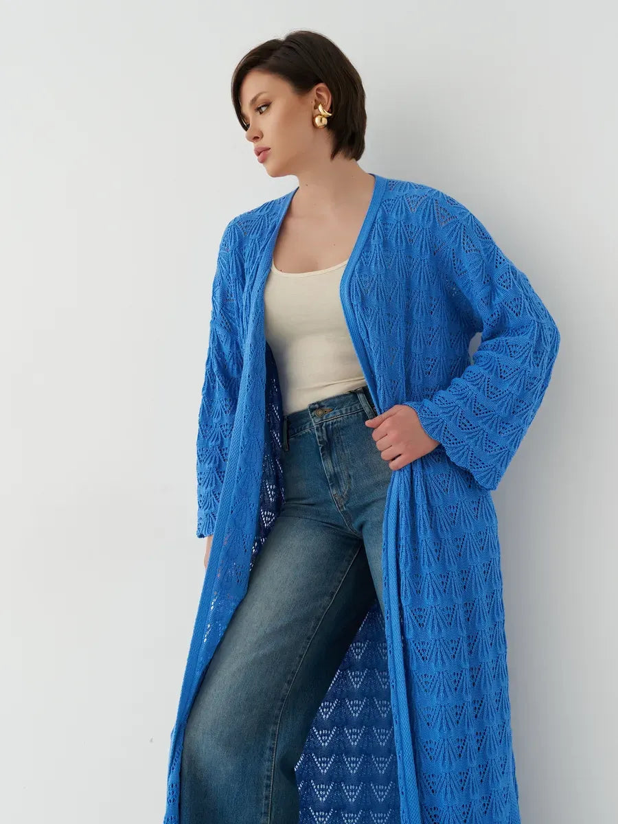 Model wearing an Azure Cardigan by Lauven, featuring a lightweight openwork design in vibrant blue.