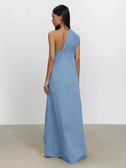 Azure Drape Maxi Dress in soft blue with an elegant one-shoulder design and fluid A-line silhouette.