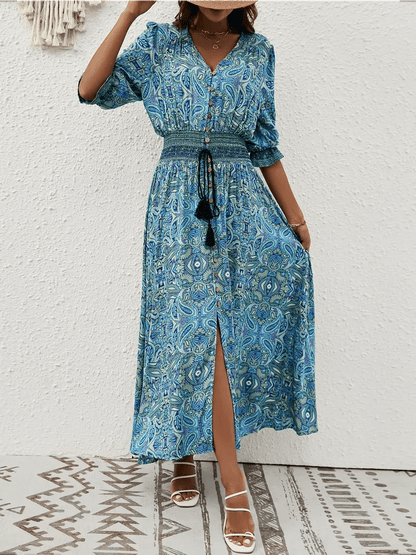 Azure Drift Maxi Dress featuring paisley print and smocked waistline, perfect for boho-chic summer styling.