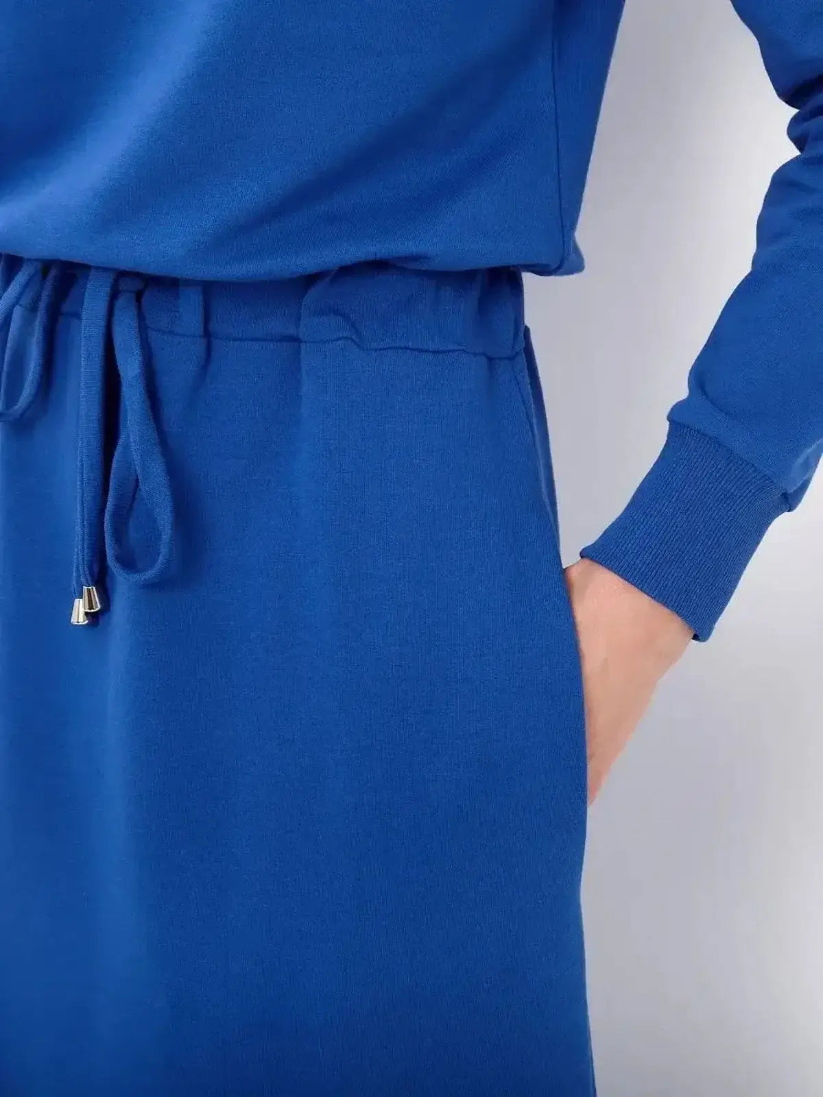 Close-up of Azure Ease Maxi Dress in cornflower blue, featuring a drawstring waist for relaxed elegance.