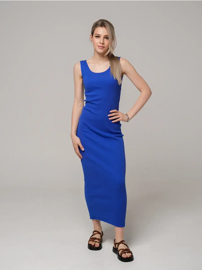 Model showcasing the Azure Elegance Maxi Dress in rich cobalt blue, featuring a sleek ribbed silhouette and ankle-skimming length.