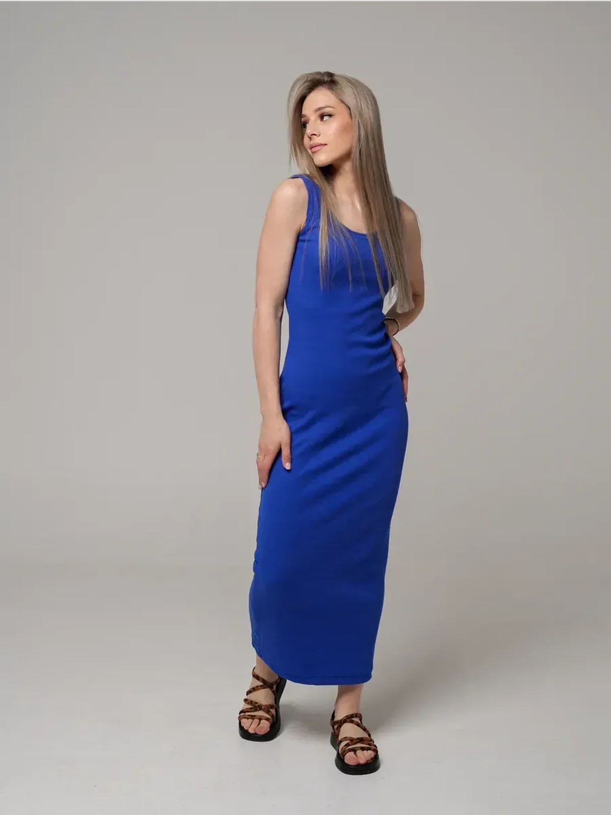 Model showcasing the Azure Elegance Maxi Dress in rich cobalt blue, featuring a sleek ribbed silhouette and ankle-skimming length.