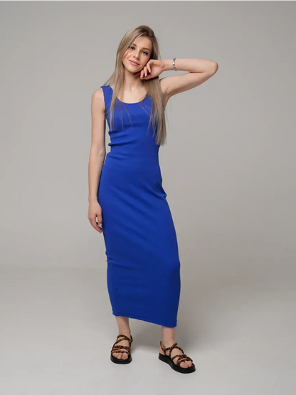 Woman wearing the Azure Elegance Maxi Dress in rich cobalt blue, showcasing a sleek ribbed silhouette and ankle-skimming length.